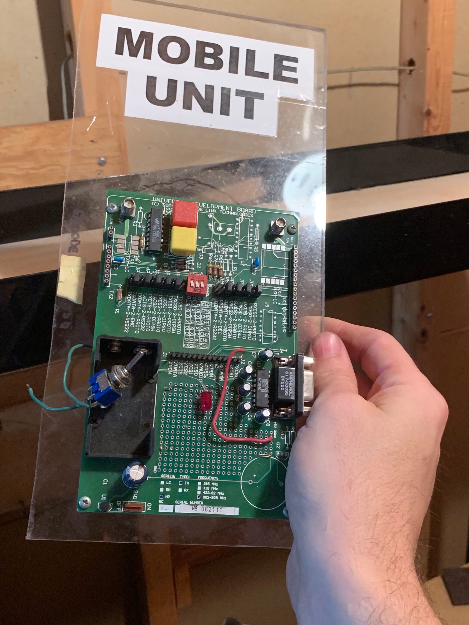 electronic evaluation board attached to plexiglass labeled MOBILE UNIT